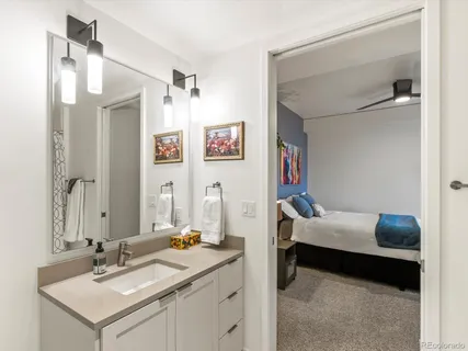 a en suite bathroom with a sink and a mirror