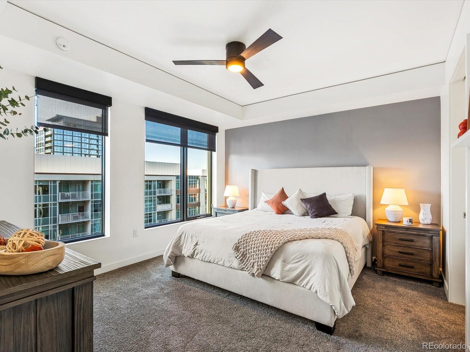 1750 Wewatta Street, Unit 1409 Denver, CO 80202 - Photo 3 of 48 a bedroom with a bed and a large window