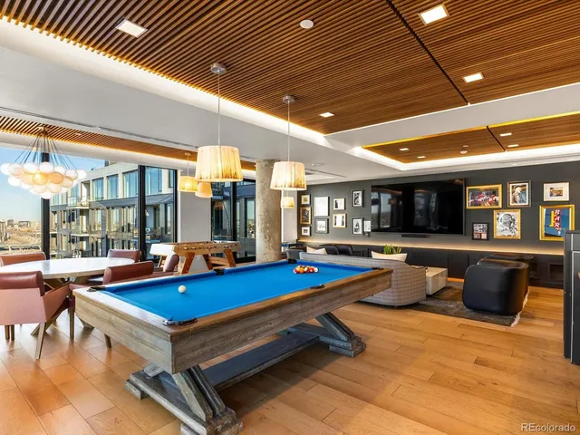 a swimming pool with outdoor seating and yard