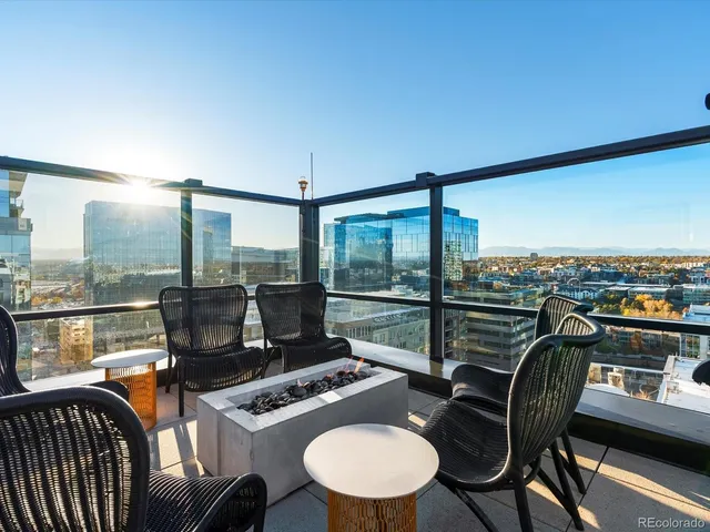a view of a swimming pool with outdoor seating