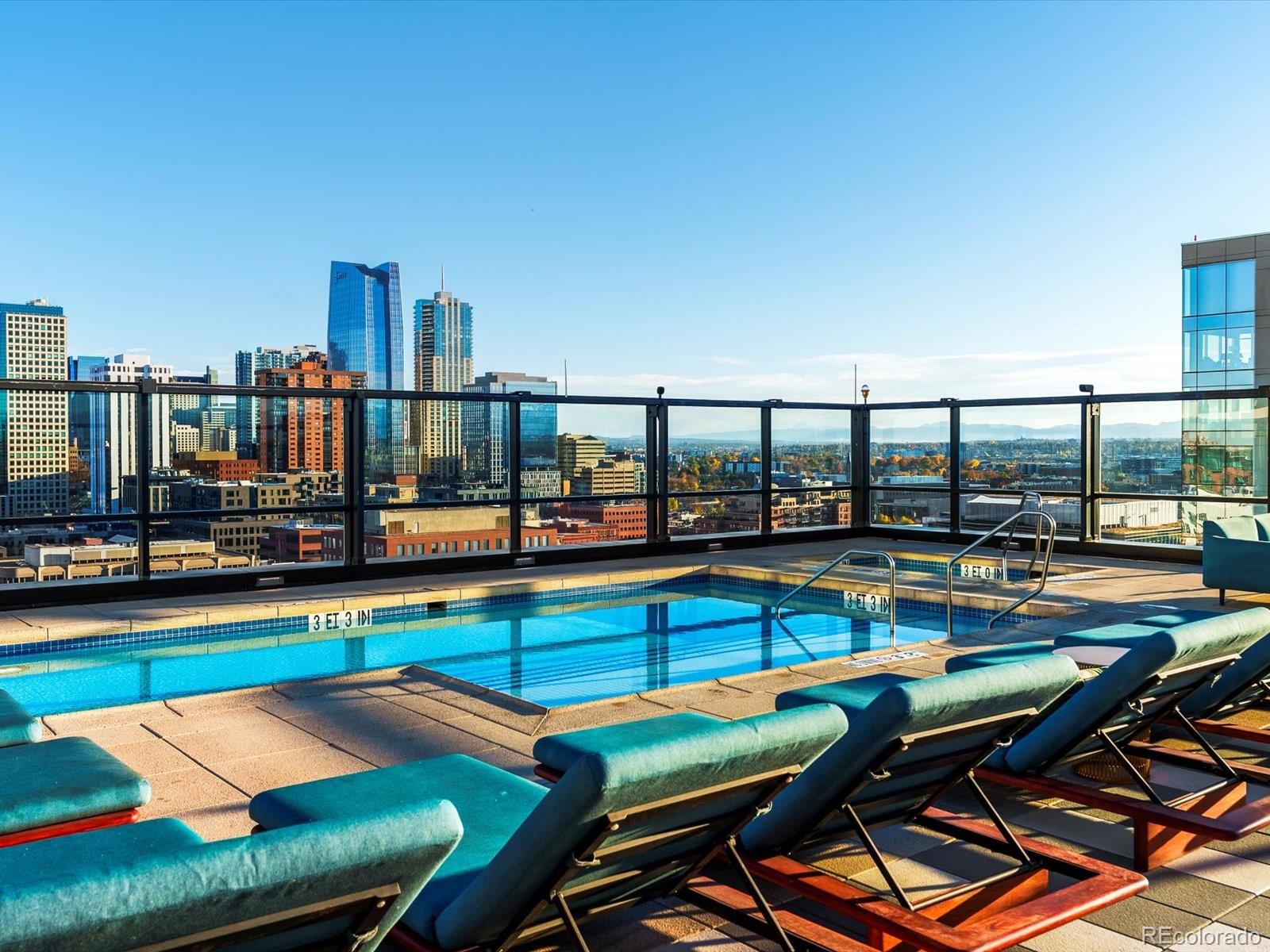 1750 Wewatta Street, Unit 1409 Denver, CO 80202 - Photo 37 of 48 a view of a swimming pool with outdoor seating