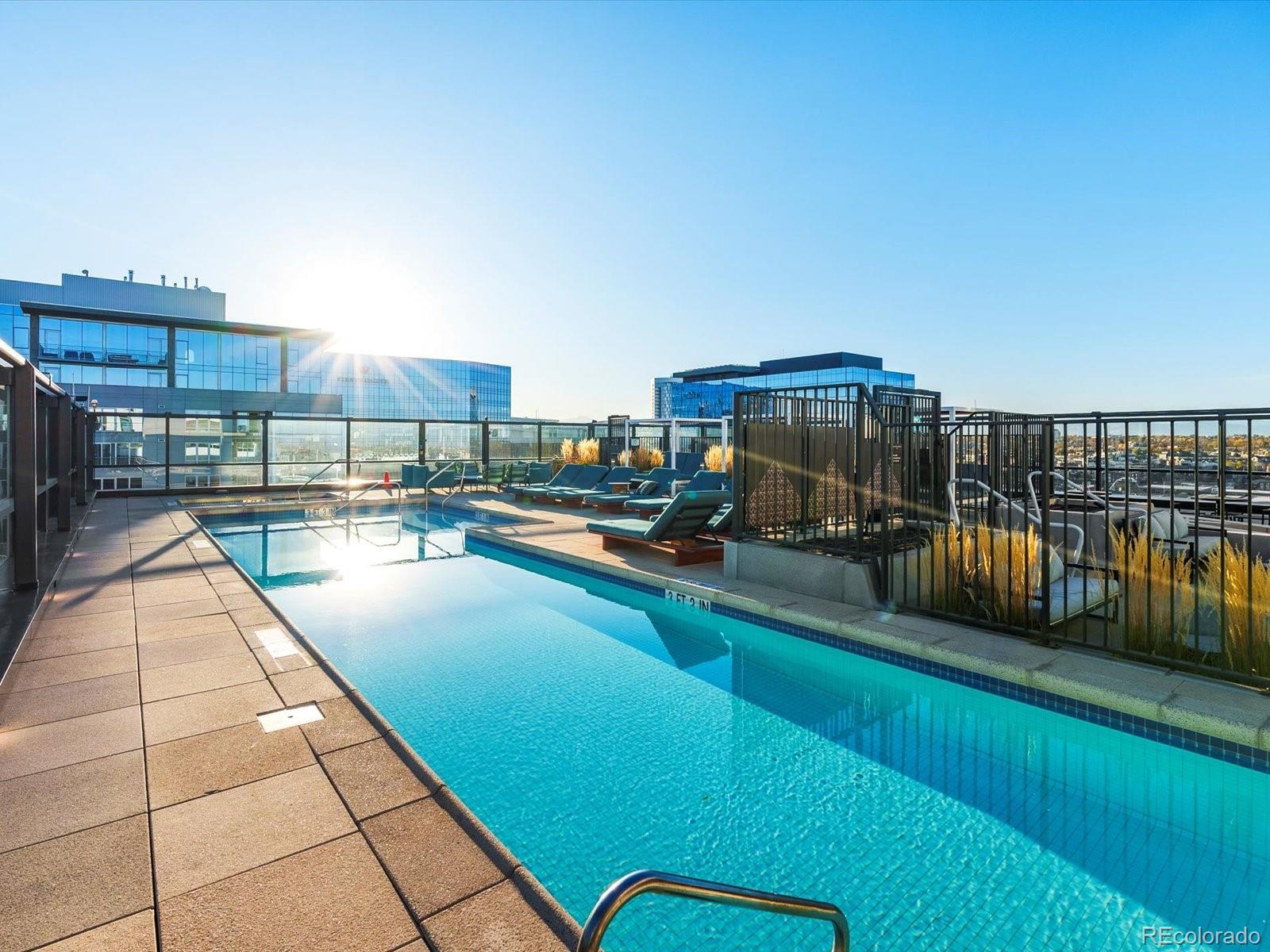 1750 Wewatta Street, Unit 1409 Denver, CO 80202 - Photo 38 of 48 a view of swimming pool from a balcony