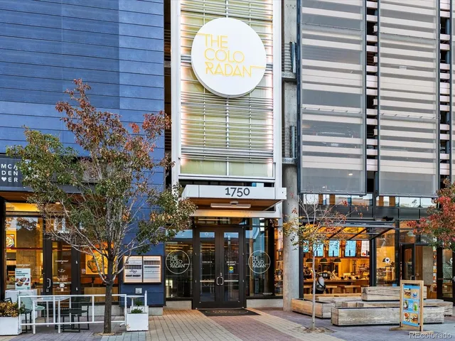 a view of a building with a tree