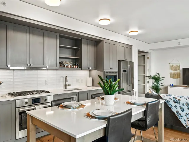a kitchen with a table and chairs in it