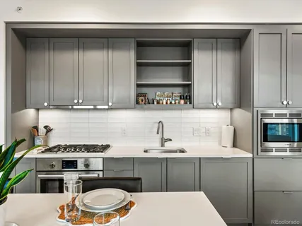 a kitchen with a cabinets and appliances