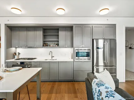a kitchen with a sink a stove and refrigerator