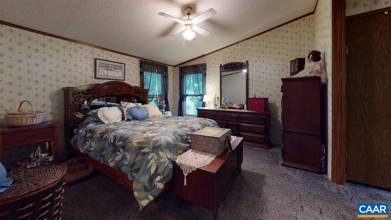 1728 Ridge Road Raphine, VA 24472 - Photo 9 of 34 a bedroom with a bed and wooden floor