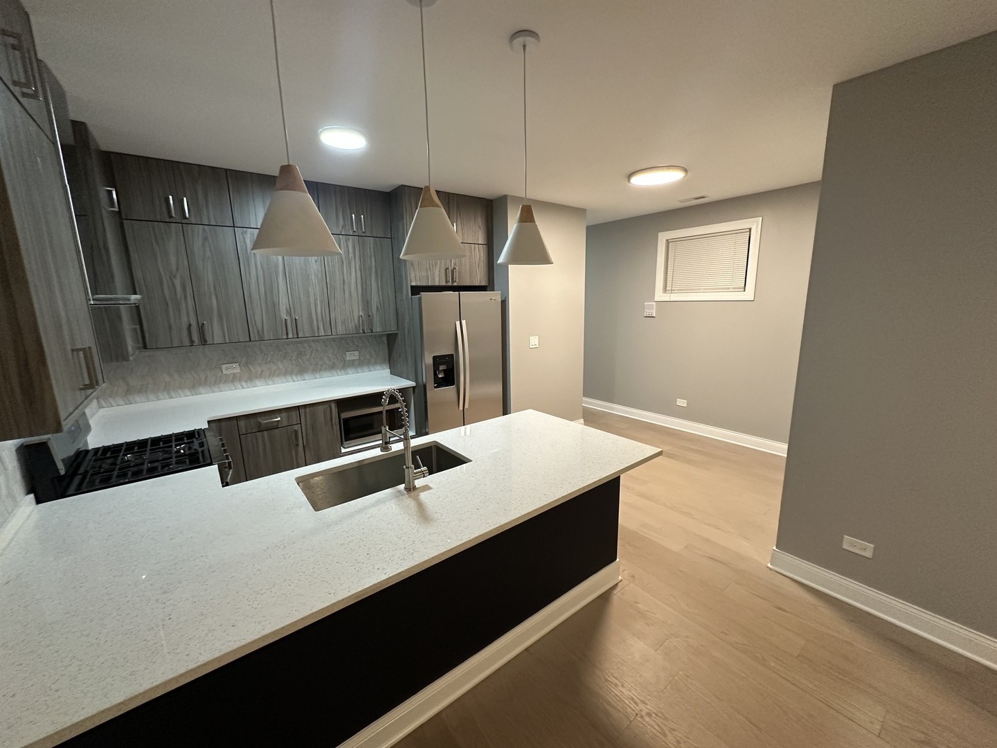 4950 South Michigan Avenue, Unit 2 Chicago, IL 60615 - Photo 2 of 13 a bathroom with a sink and a mirror