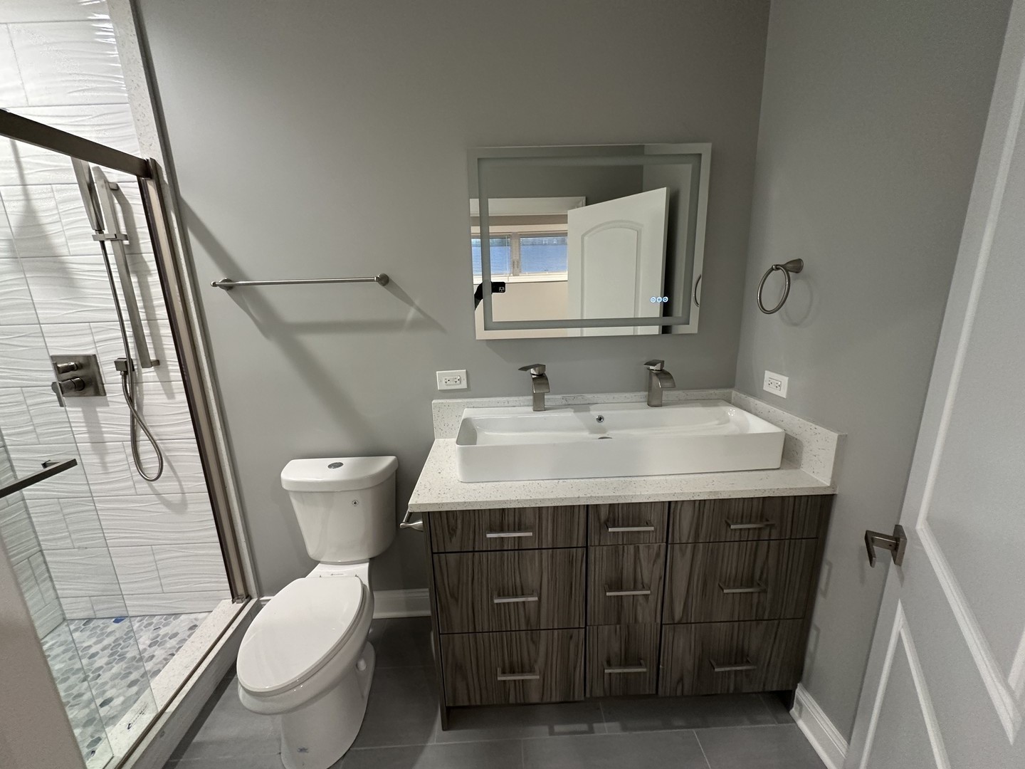 4950 South Michigan Avenue, Unit 2 Chicago, IL 60615 - Photo 3 of 13 a bathroom with a sink vanity mirror and toilet
