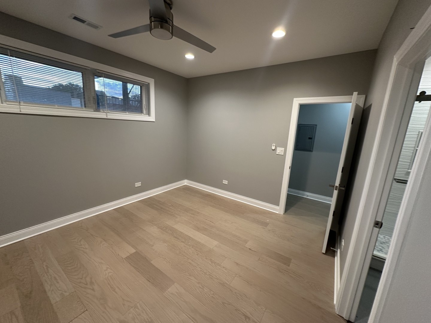 4950 South Michigan Avenue, Unit 2 Chicago, IL 60615 - Photo 8 of 13 an empty room with windows