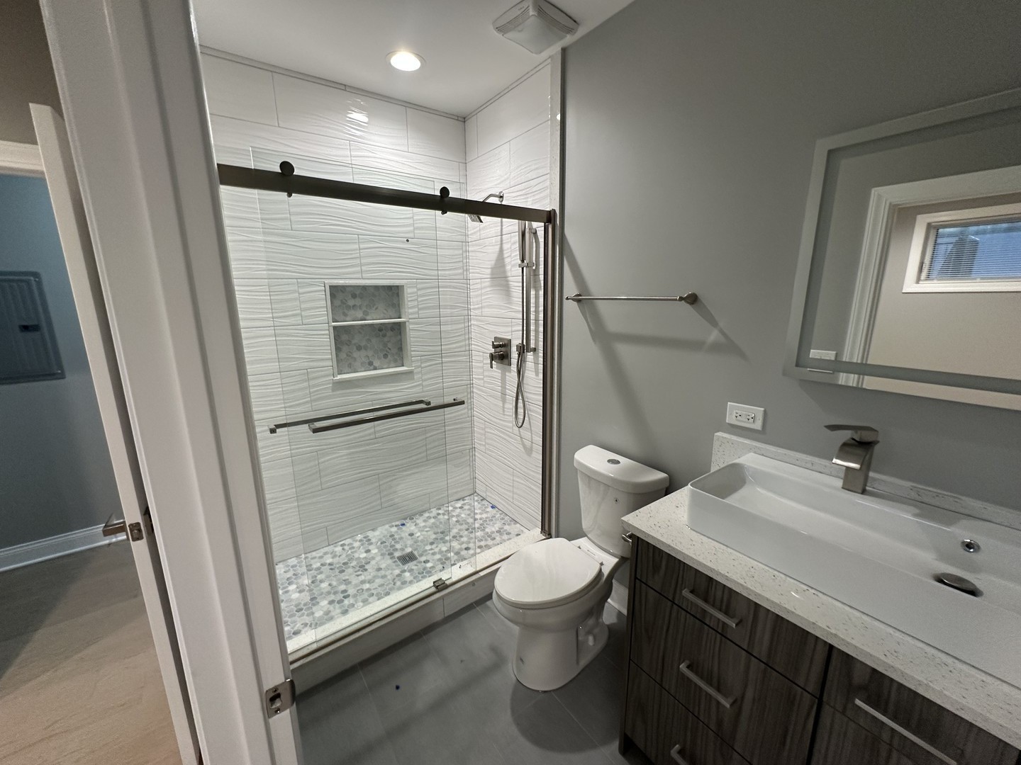 4950 South Michigan Avenue, Unit 2 Chicago, IL 60615 - Photo 9 of 13 a bathroom with a sink toilet and shower