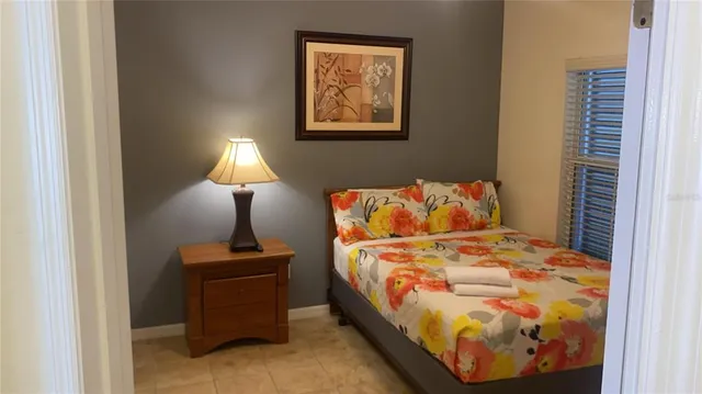 a bathroom with a granite countertop shower and a toilet