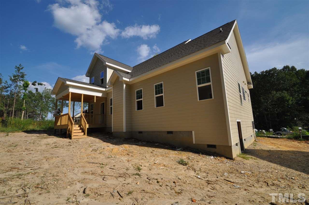 2025 Sageleaf Court Raleigh, NC 27603 - Photo 13 of 14 a view of a house with a yard