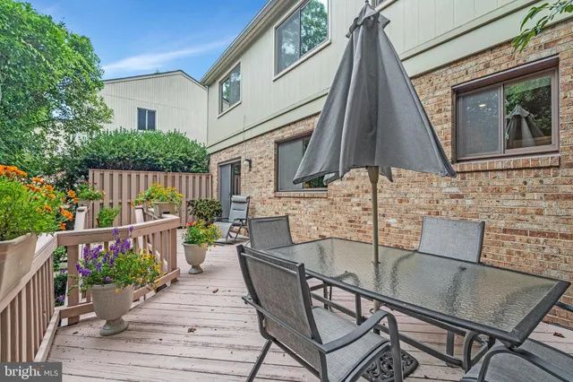 a view of a table and chairs on the roof deck