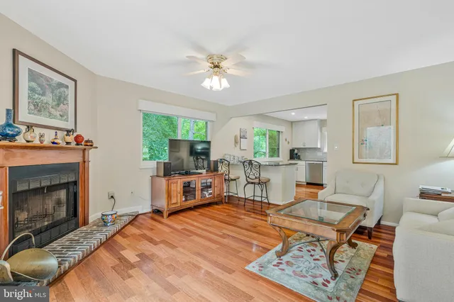 a view of a hallway with wooden floor and entryway