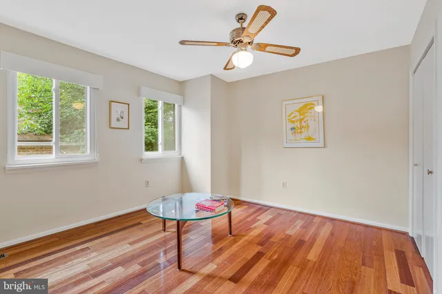 a bathroom with a sink a large mirror and a window