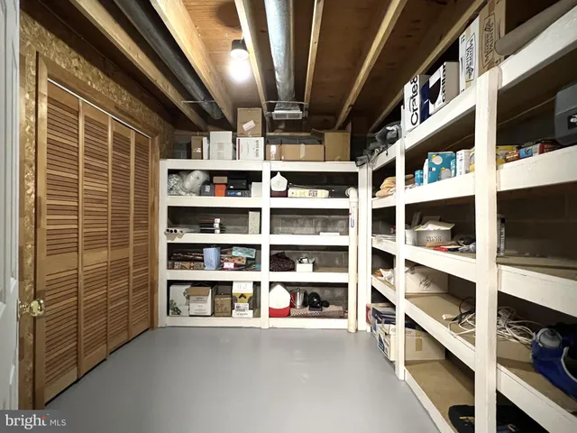 a view of house with backyard and glass windows