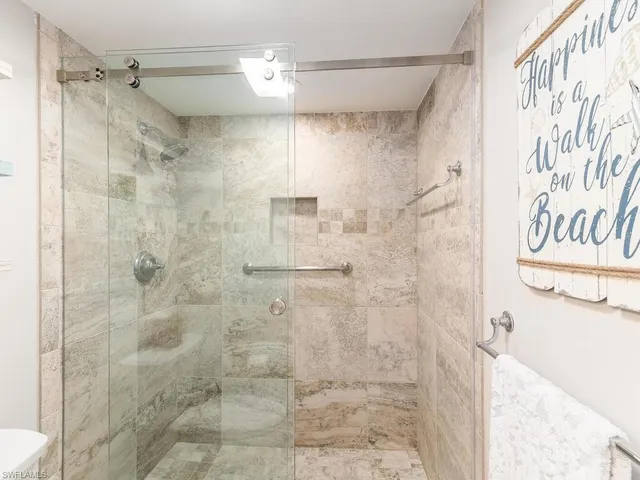a bathroom with a shower and a shower