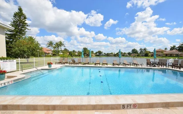 a view of a swimming pool and an outdoor space
