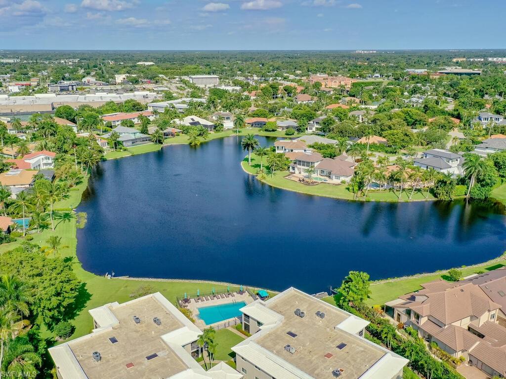 4180 Crayton Road, Unit E7 Naples, FL 34103 - Photo 29 of 35 an aerial view of a house with a lake view