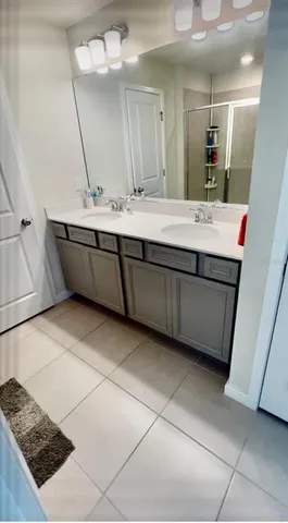a bathroom with a sink mirror vanity and toilet