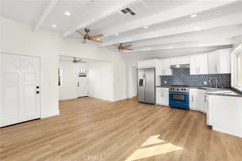 a kitchen with a stove and a refrigerator