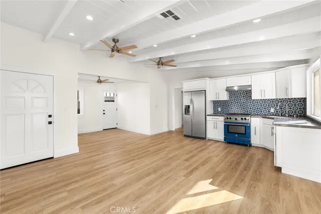 a kitchen with a stove and a refrigerator