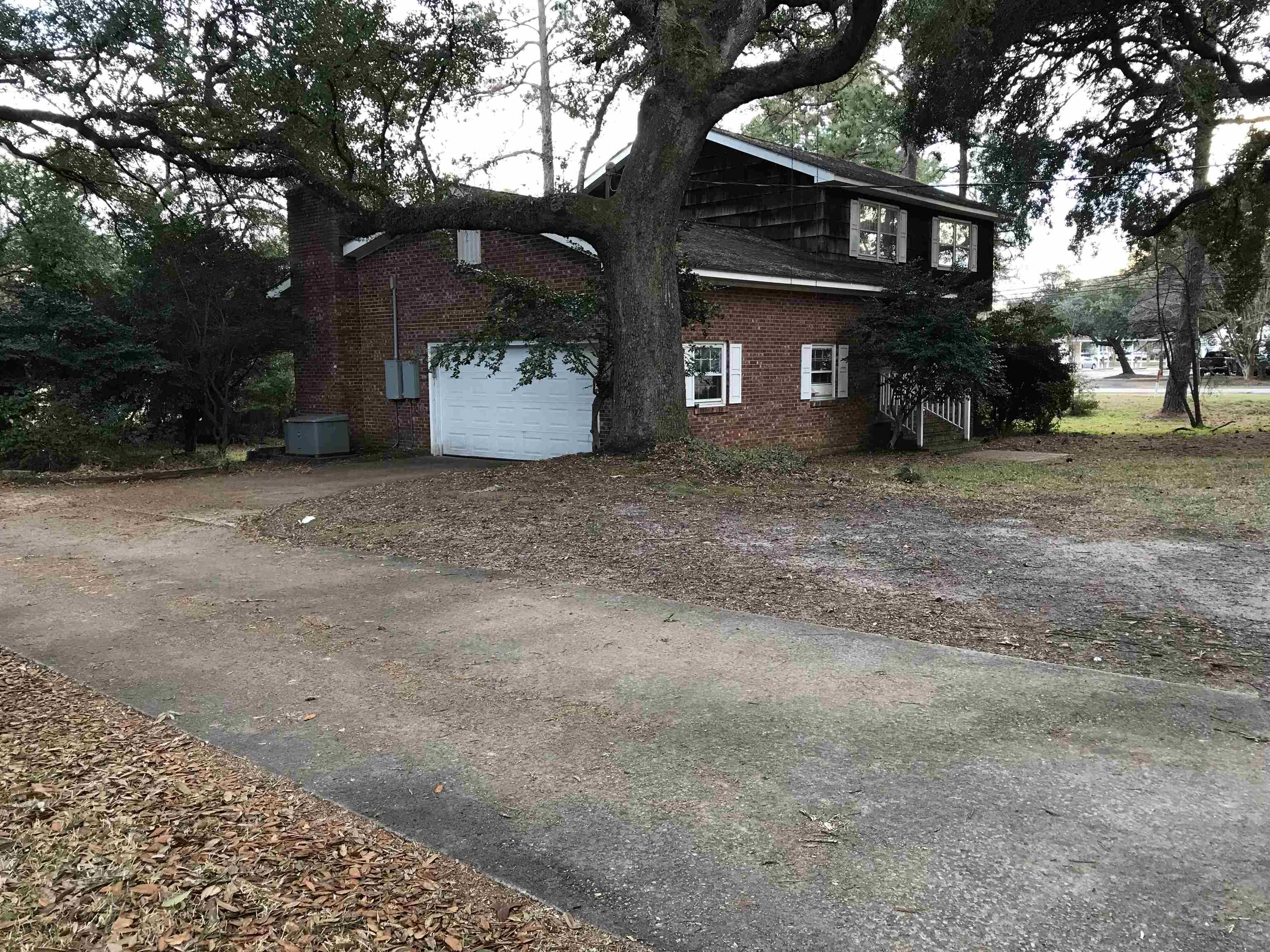 1201 Landgrave Street Georgetown, SC 29440 - Photo 4 of 38 View of home's exterior with brick siding, driveway, and a garage