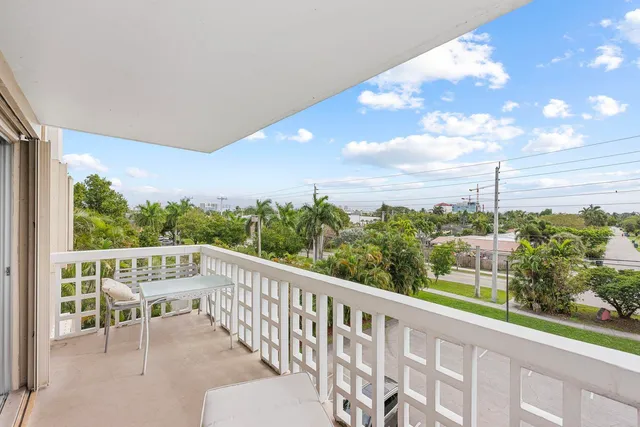 a view of balcony with furniture