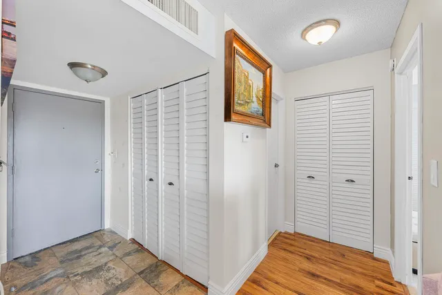 a view of a bedroom with wooden floor and small space