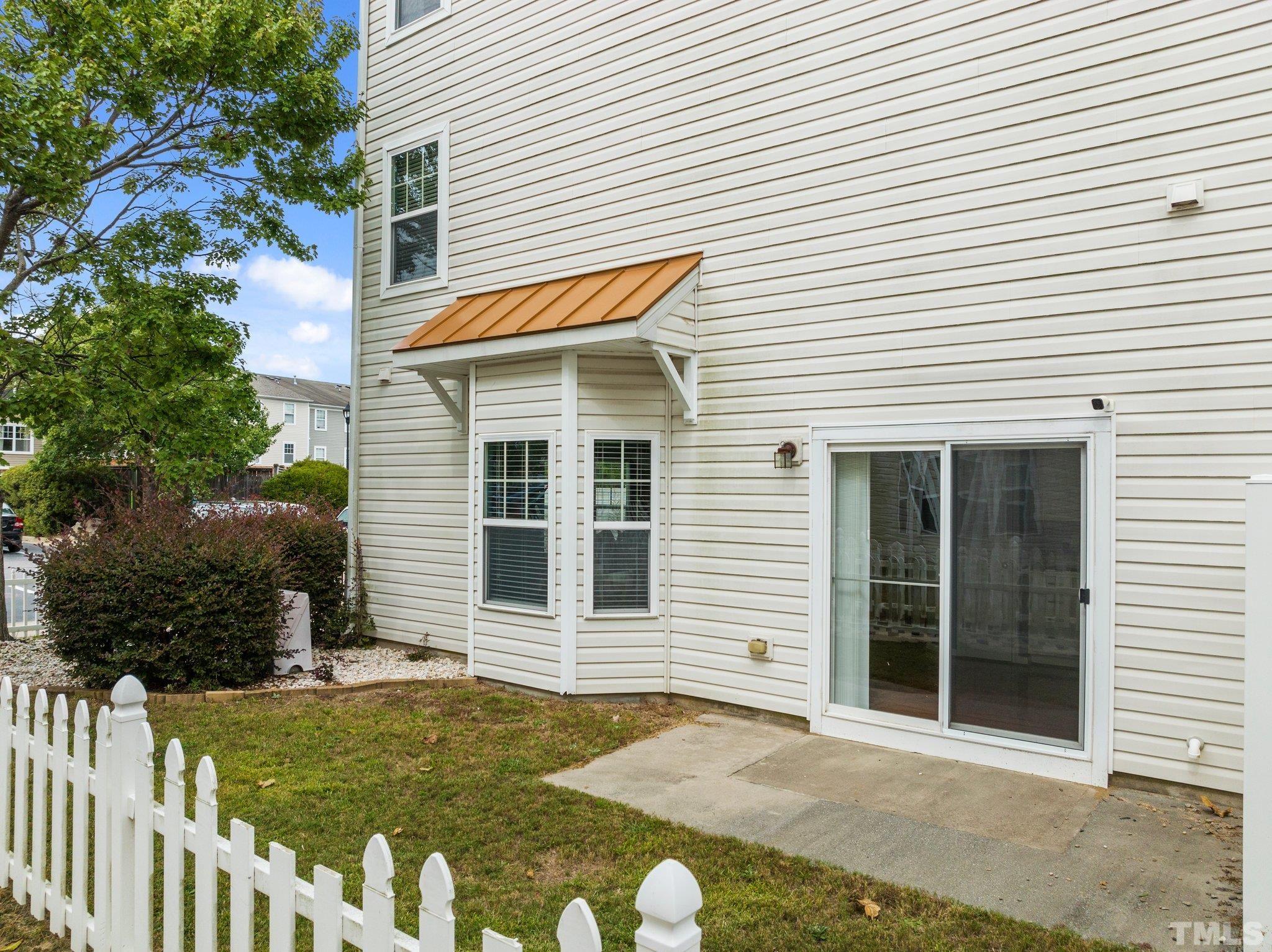 11720 Coppergate Drive, Unit 100 Raleigh, NC 27614 - Photo 18 of 22 a front view of a house with a yard
