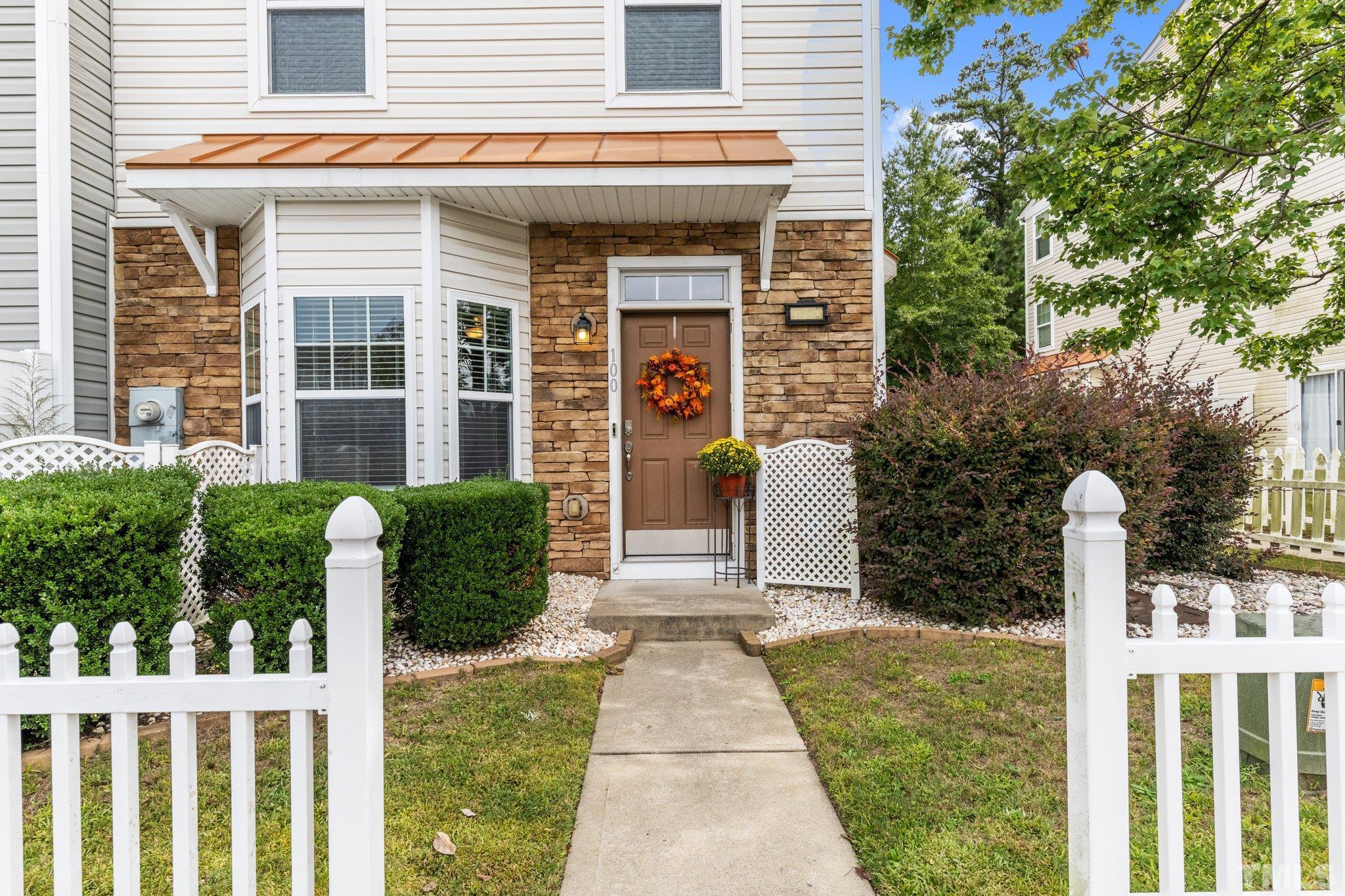 11720 Coppergate Drive, Unit 100 Raleigh, NC 27614 - Photo 2 of 22 a front view of a house with garden