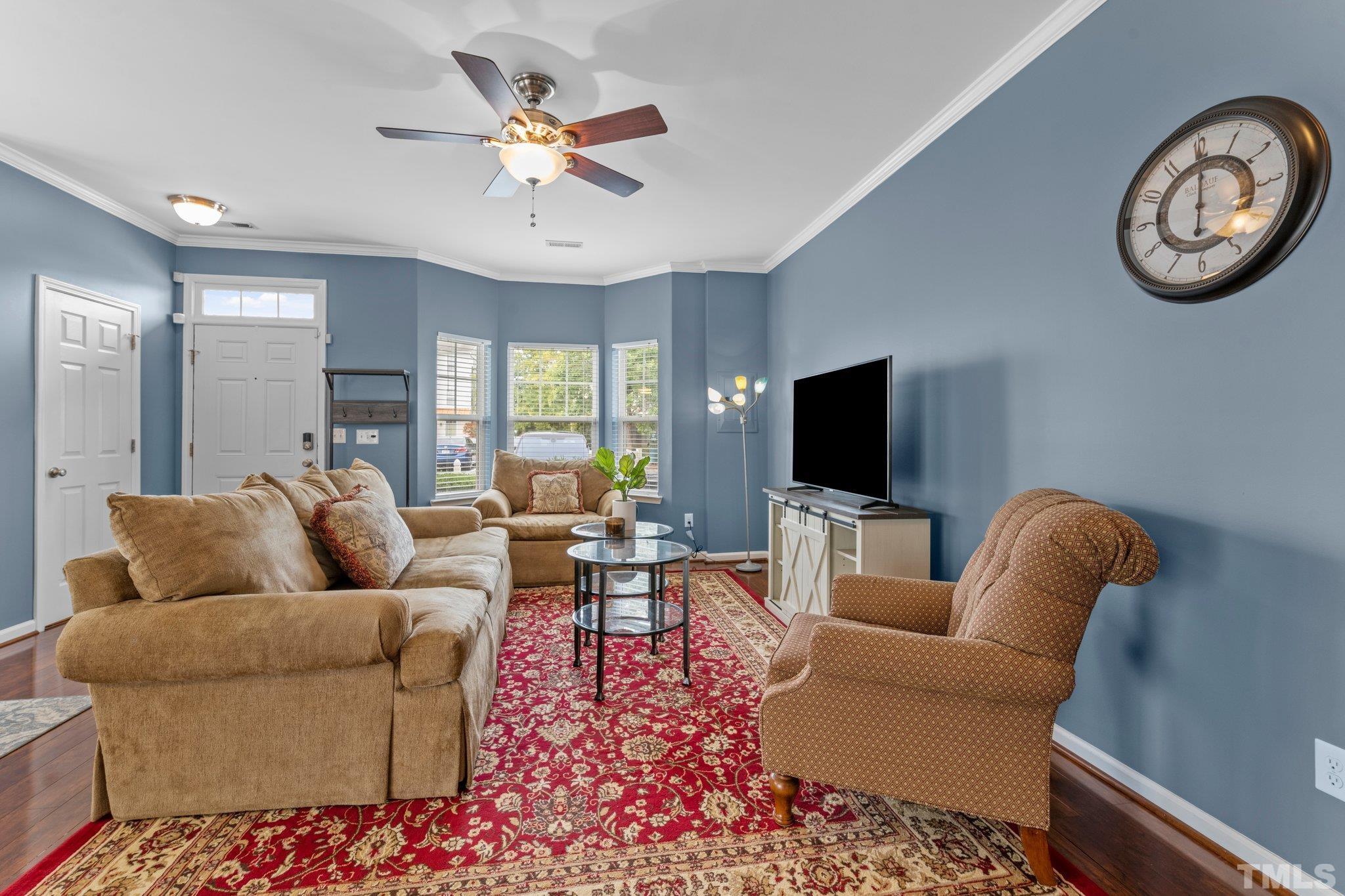 11720 Coppergate Drive, Unit 100 Raleigh, NC 27614 - Photo 3 of 22 a living room with furniture and a large window