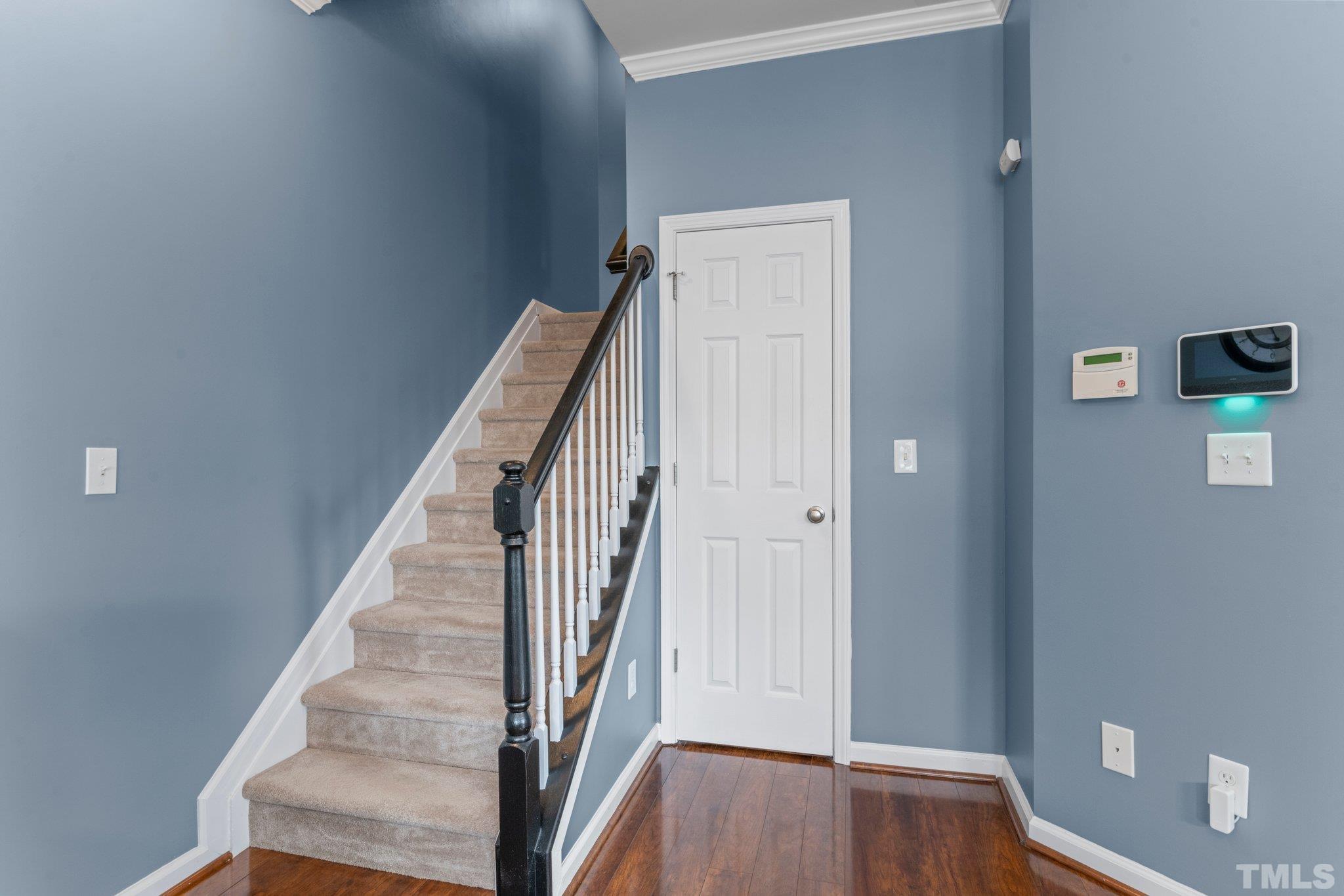 11720 Coppergate Drive, Unit 100 Raleigh, NC 27614 - Photo 9 of 22 a view of a hallway with wooden floor and entryway