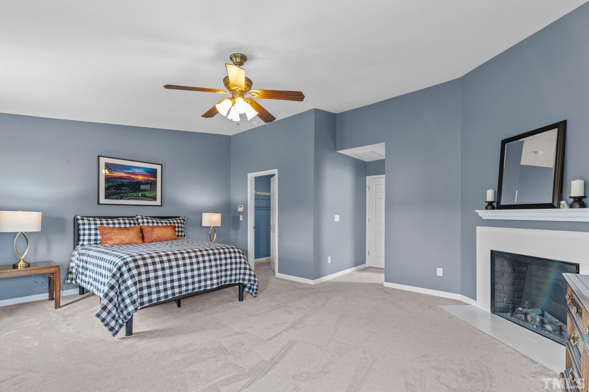 11720 Coppergate Drive, Unit 100 Raleigh, NC 27614 - Photo 10 of 22 a living room with furniture a baby crib and a window