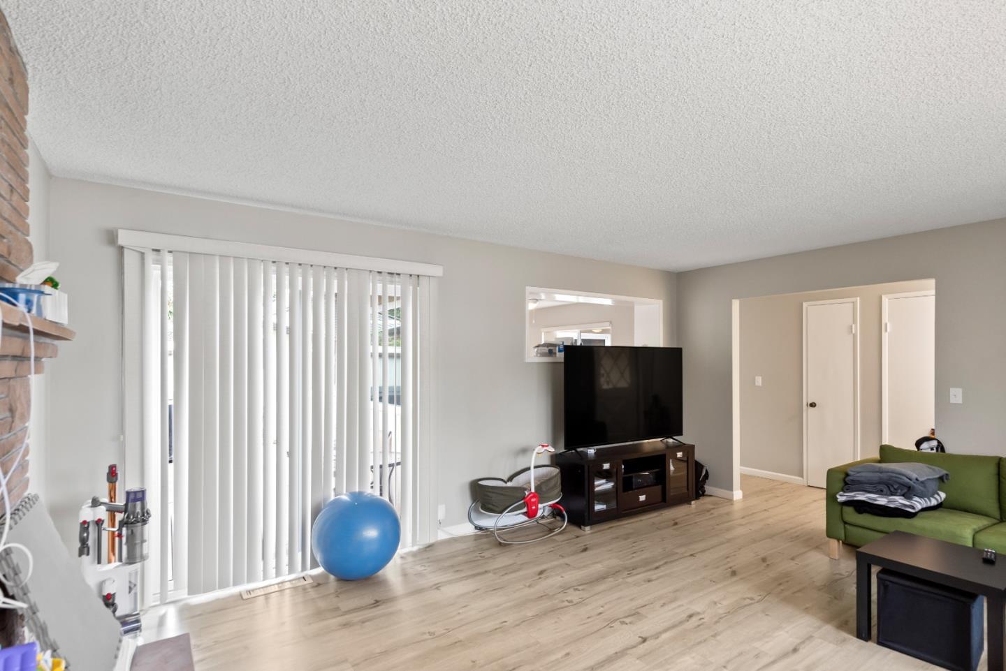 1010 Williams Way Mountain View, CA 94040 - Photo 3 of 26 a living room with furniture and a flat screen tv