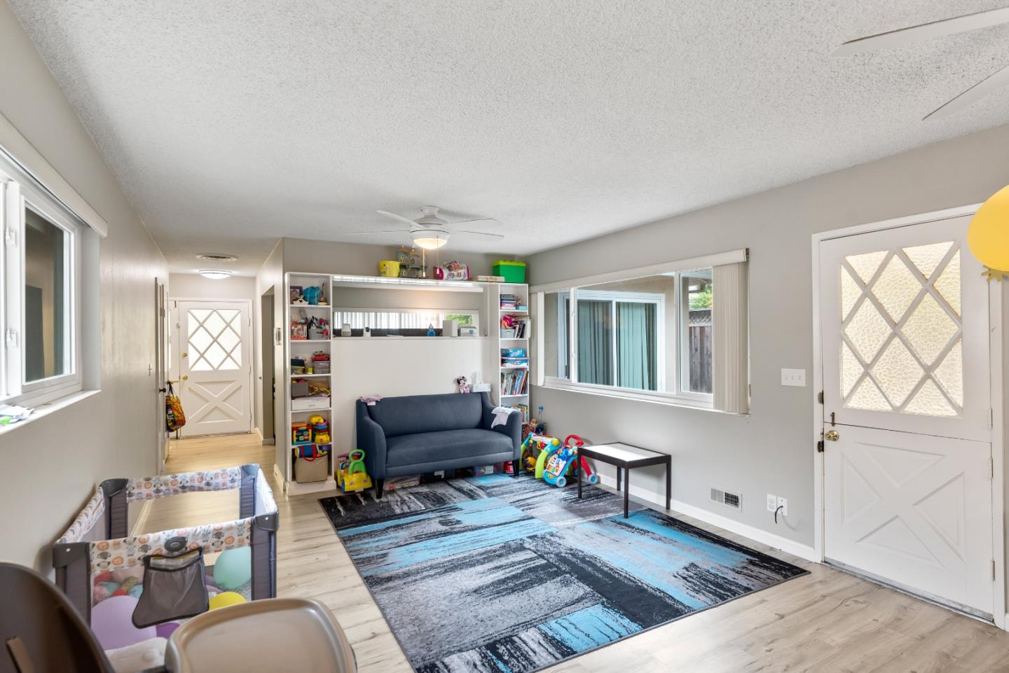 1010 Williams Way Mountain View, CA 94040 - Photo 5 of 26 a living room with furniture a flat screen tv and a window