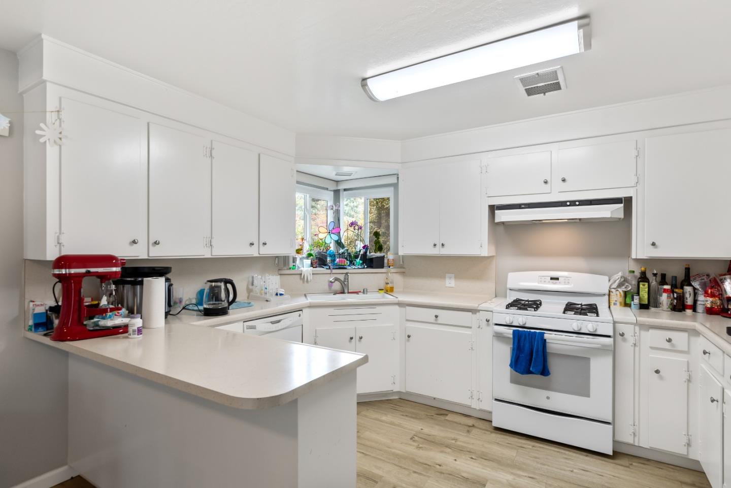 1010 Williams Way Mountain View, CA 94040 - Photo 7 of 26 a kitchen with white cabinets appliances and a sink