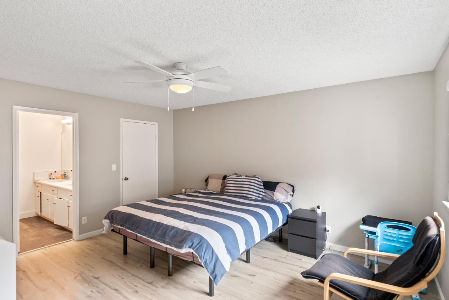 1010 Williams Way Mountain View, CA 94040 - Photo 9 of 26 a bedroom with a bed and a chandelier