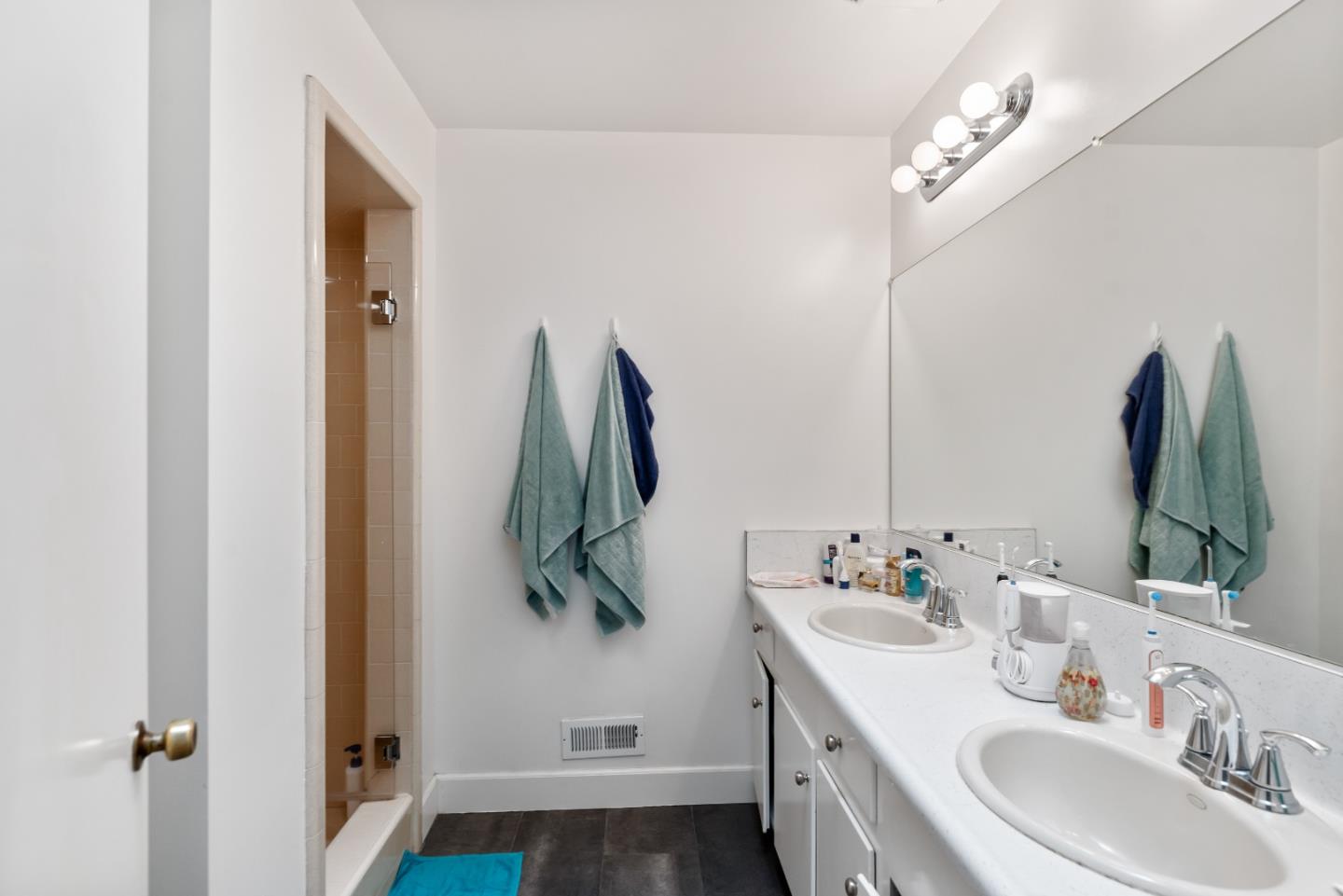 1010 Williams Way Mountain View, CA 94040 - Photo 10 of 26 a bathroom with a double vanity sink and a mirror