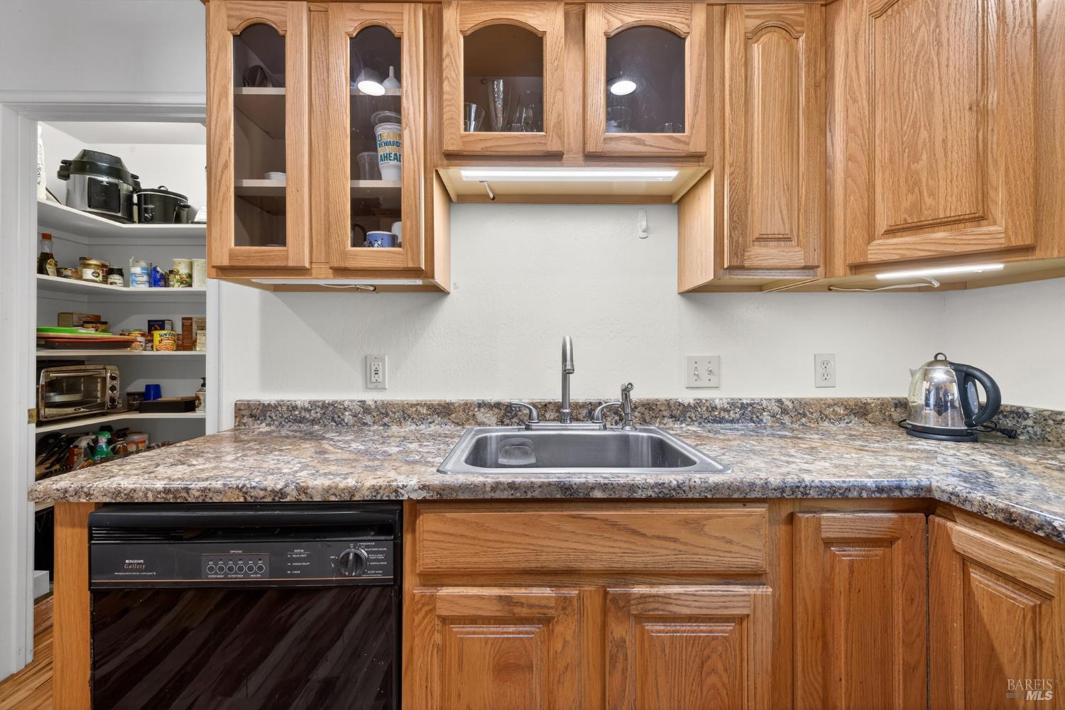 3320 Redwood Road Napa, CA 94558 - Photo 41 of 57 a kitchen with stainless steel appliances granite countertop a sink stove and cabinets
