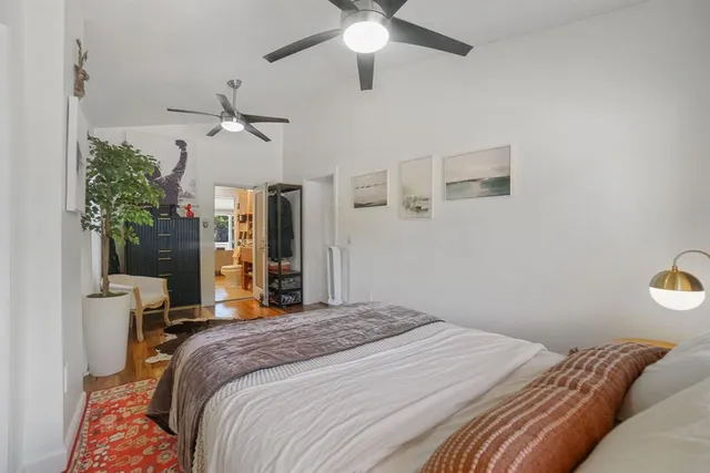 a view of a house with backyard sitting area and garden