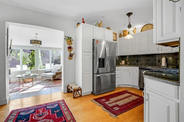 a dining room with furniture and wooden floor
