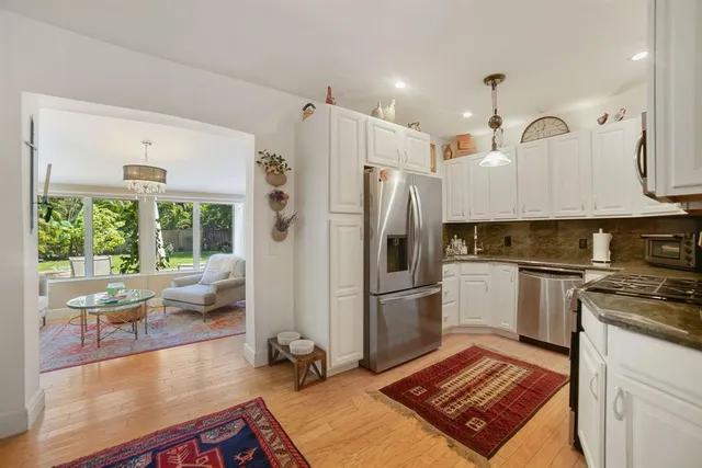 a bed room with a bed and a chair