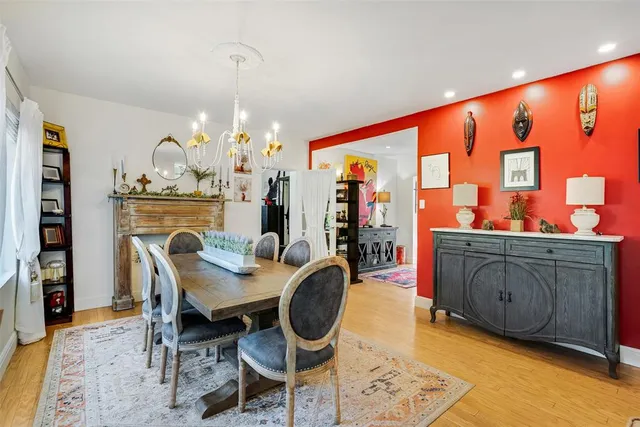 a living room with furniture a flat screen tv and a window