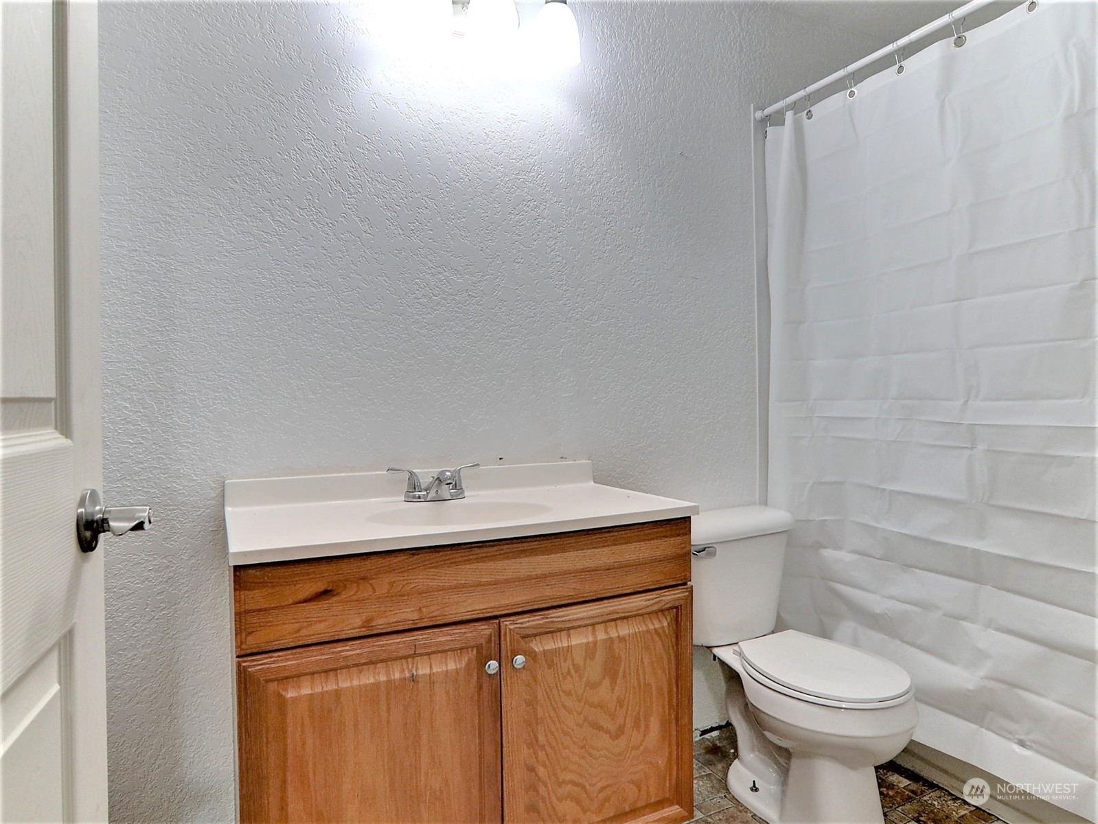 2629 Rucker Avenue, Unit 6 Everett, WA 98201 - Photo 11 of 14 a bathroom with a sink toilet and a mirror
