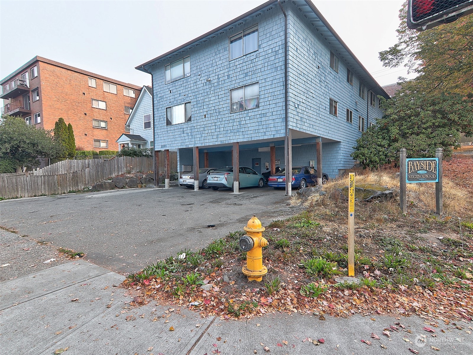 2629 Rucker Avenue, Unit 6 Everett, WA 98201 - Photo 14 of 14 a backyard of a house with barbeque oven fire pit table and chairs