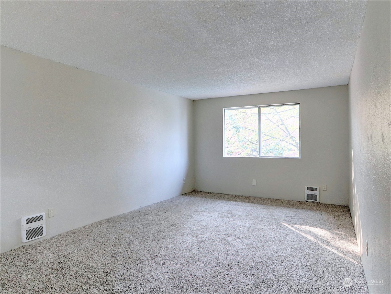 2629 Rucker Avenue, Unit 6 Everett, WA 98201 - Photo 6 of 14 an empty room with a window