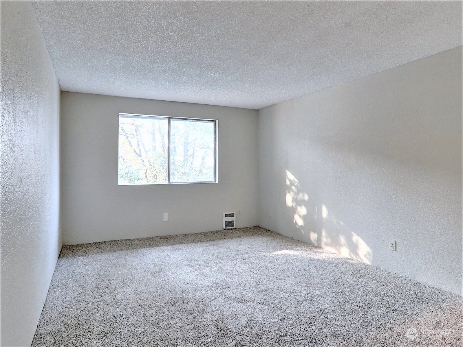 2629 Rucker Avenue, Unit 6 Everett, WA 98201 - Photo 7 of 14 a view of an empty room with a window