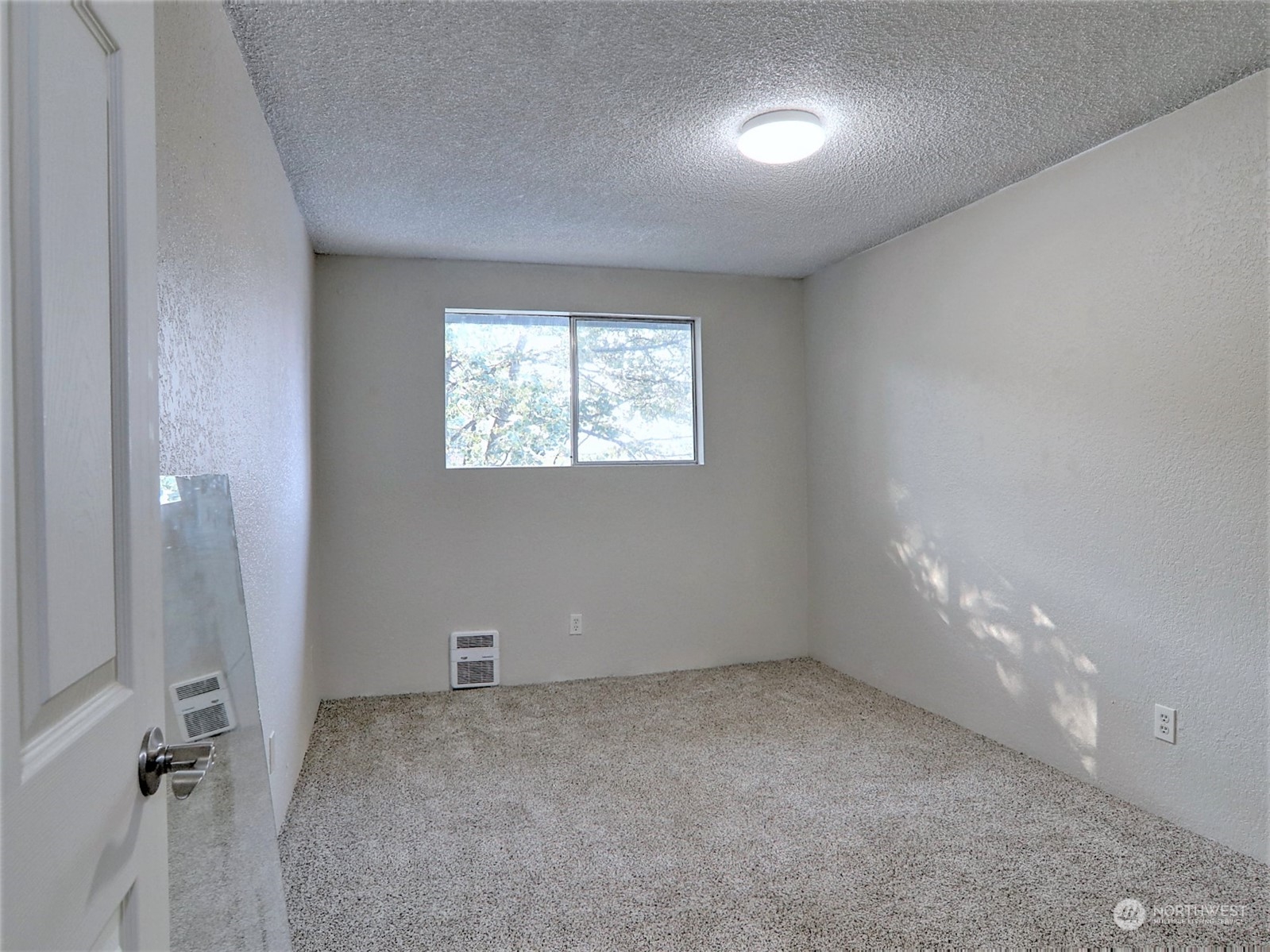 2629 Rucker Avenue, Unit 6 Everett, WA 98201 - Photo 9 of 14 an empty room with windows